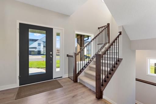 Dramatic staircase with lots of windows on the front of the home