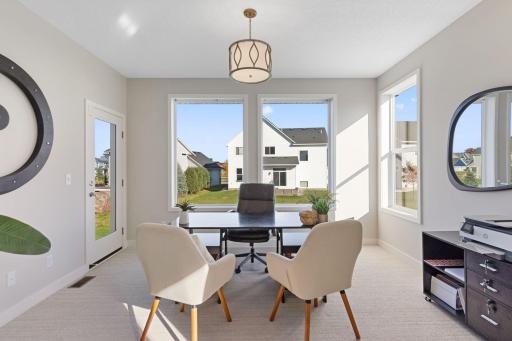 Study in the back of the home with glass door to future deck
