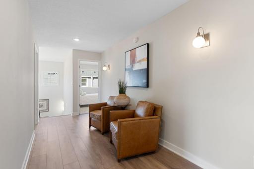 Wide upper hallway for a sitting area, bookshelves, or desks for studying/art projects