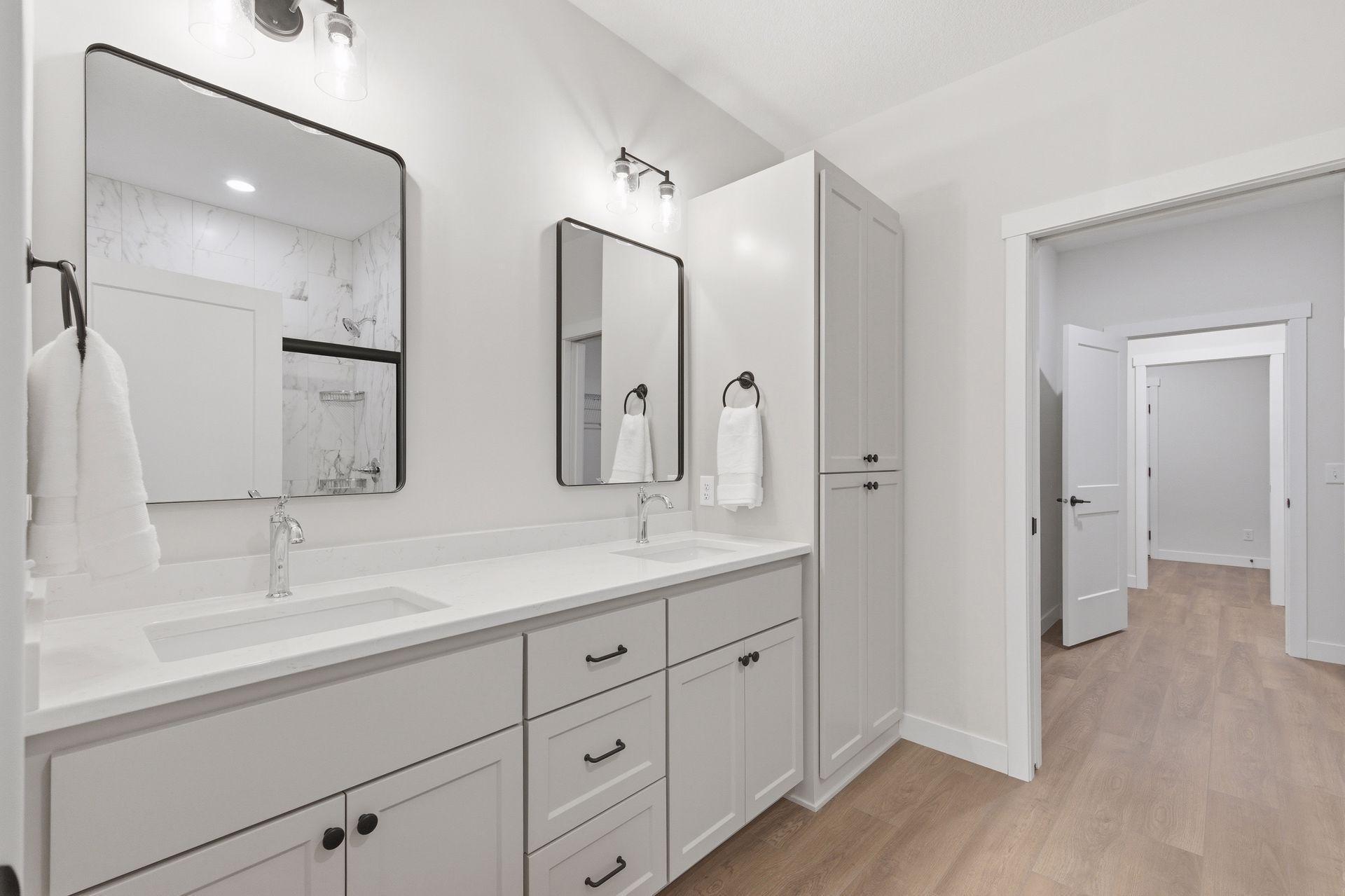 Private primary bath features dual sink vanity