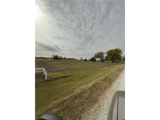 Rail fence allows for animals to graze without fear of wandering too far