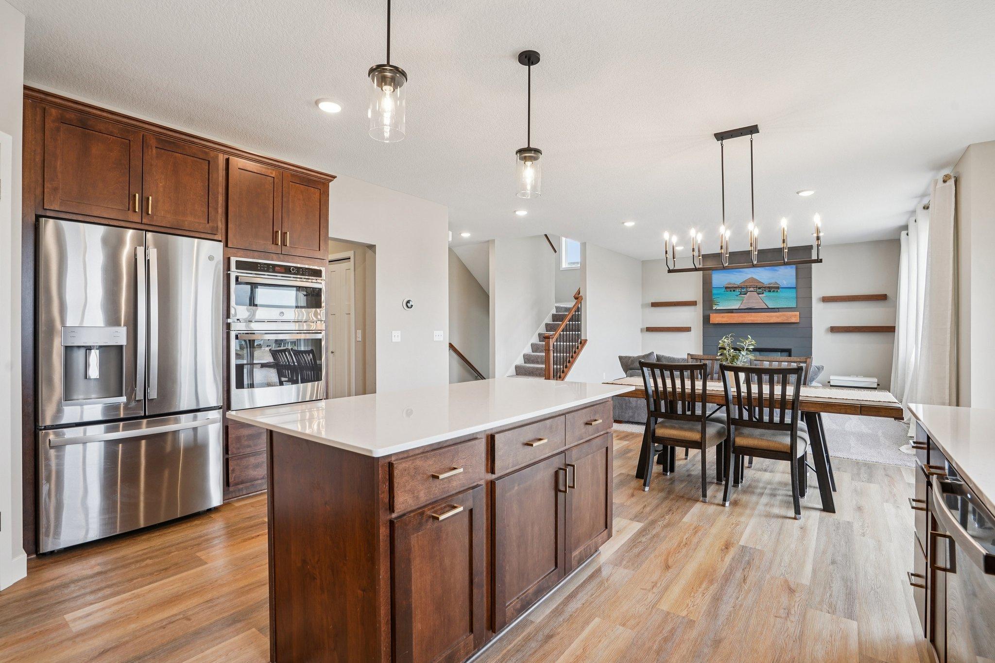 Wall oven, built-in microwave, cooktop and hood.