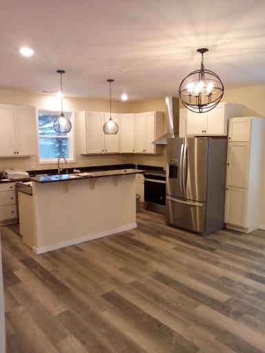 Tasteful lighting and 9 foot ceilings feel welcoming and spacious.