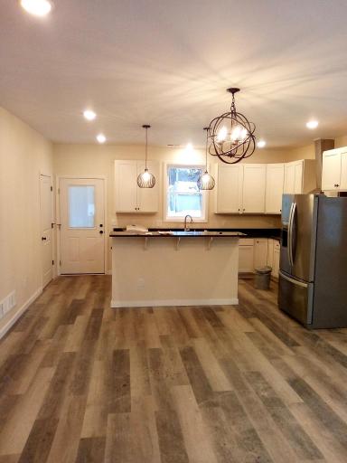 Kitchen has an access to the large patio and backyard.
