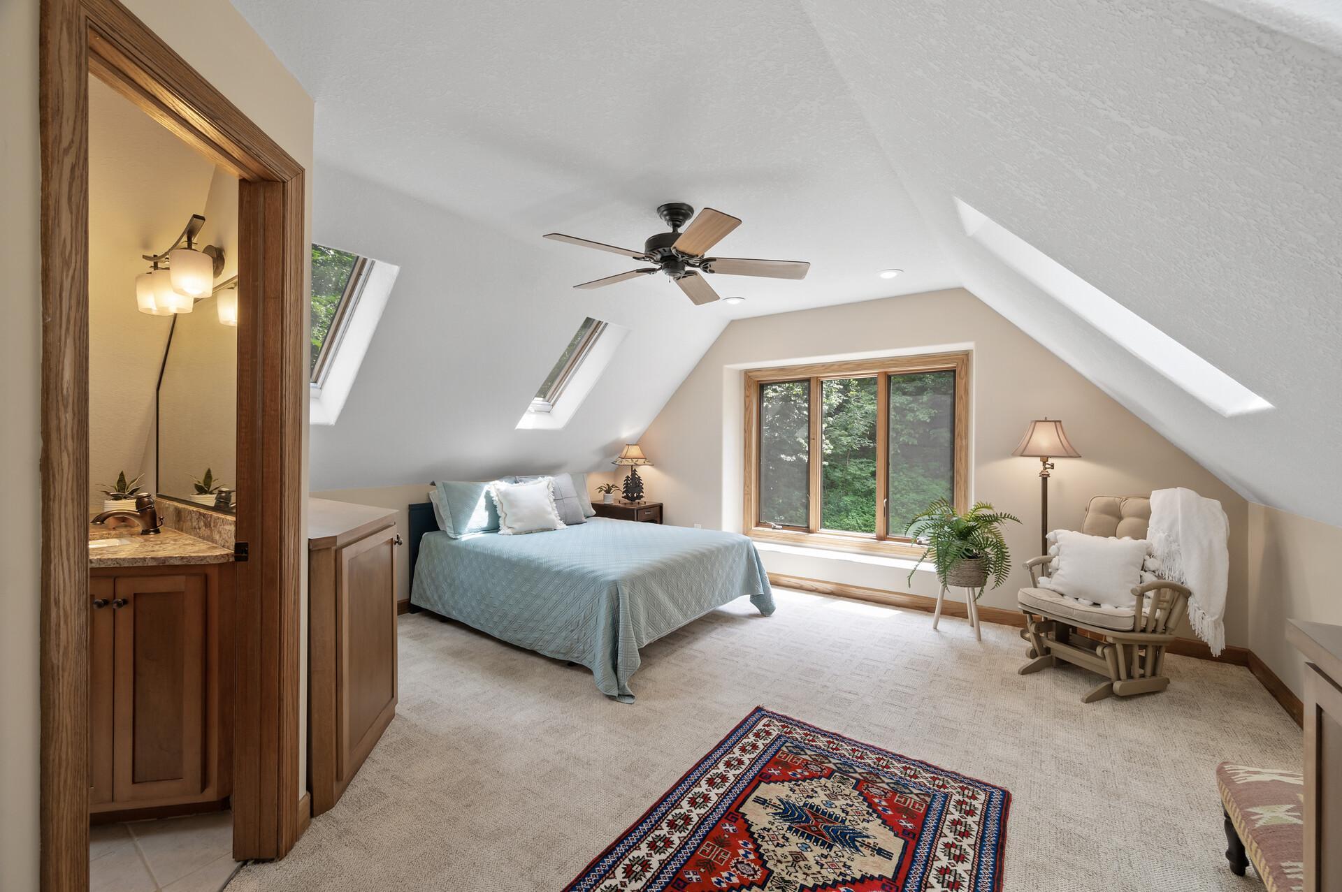 sleeping area with 3/4 bath and laundry on upper level