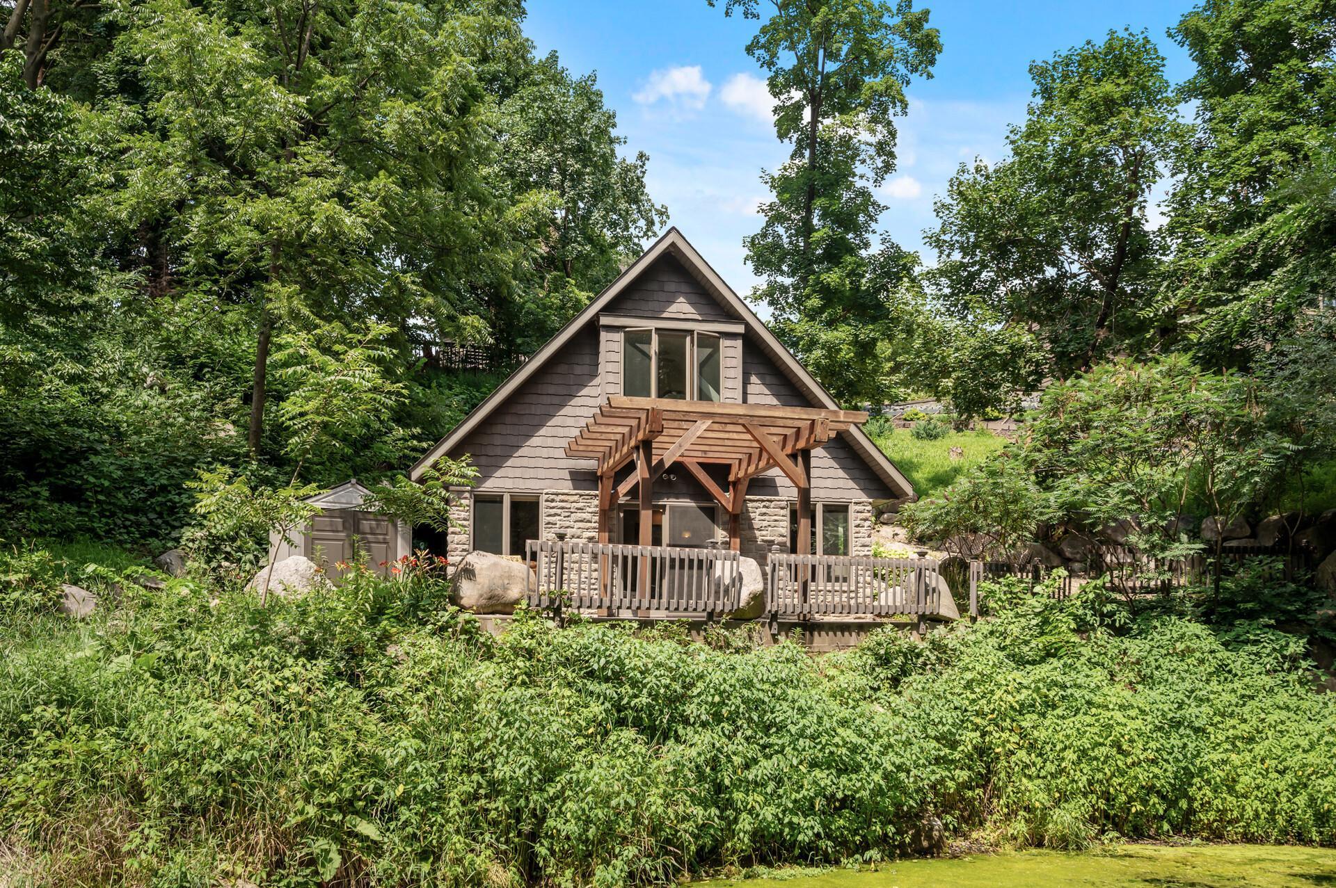 Cottage with expansive deck with pergola