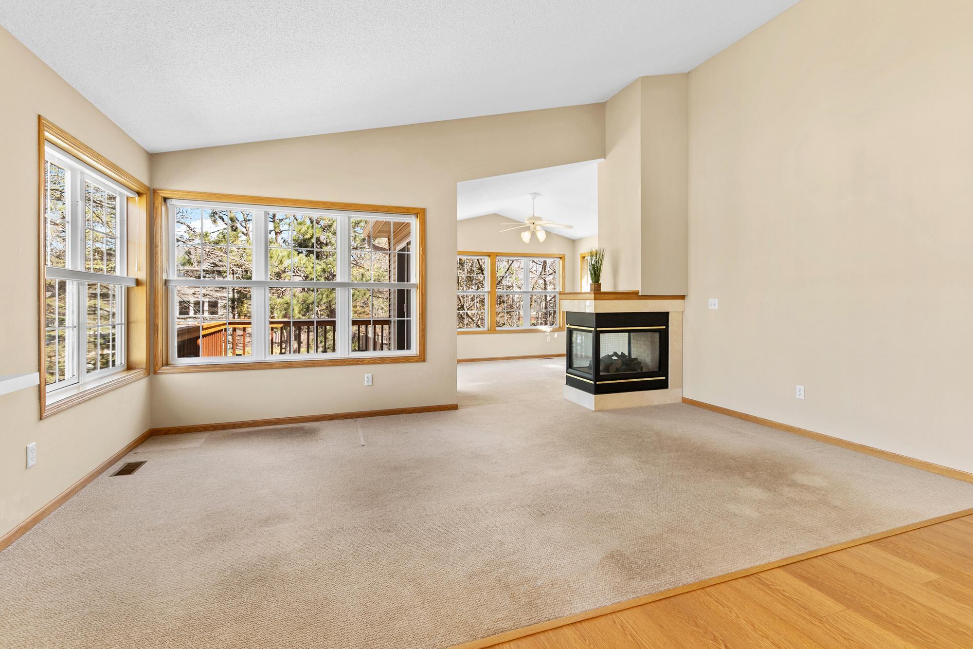 Main floor fireplace warms living room and sunroom
