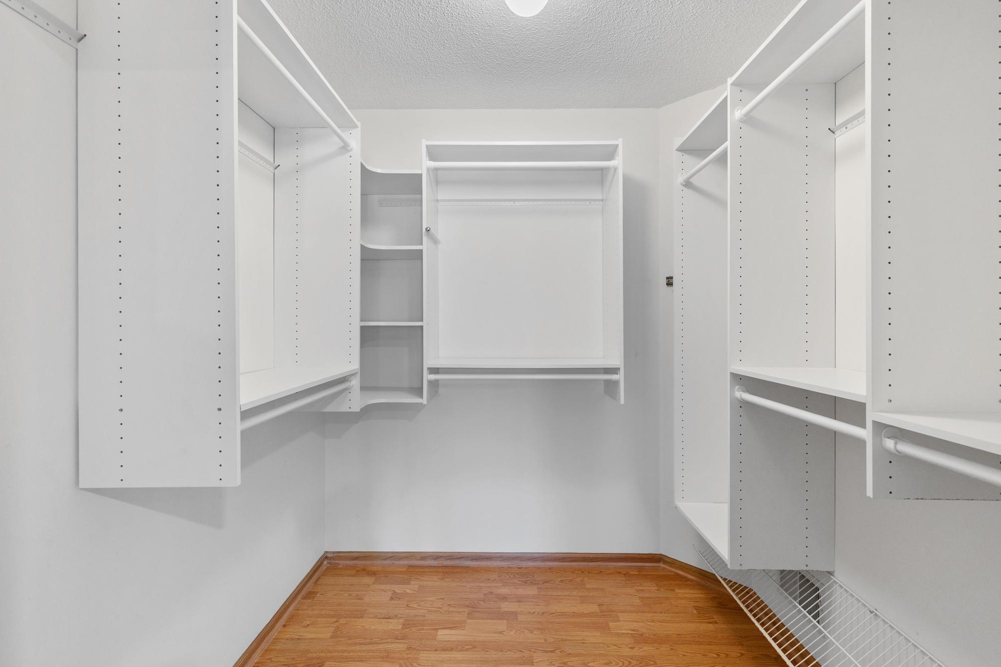 Large walk-in primary bedroom closet closet