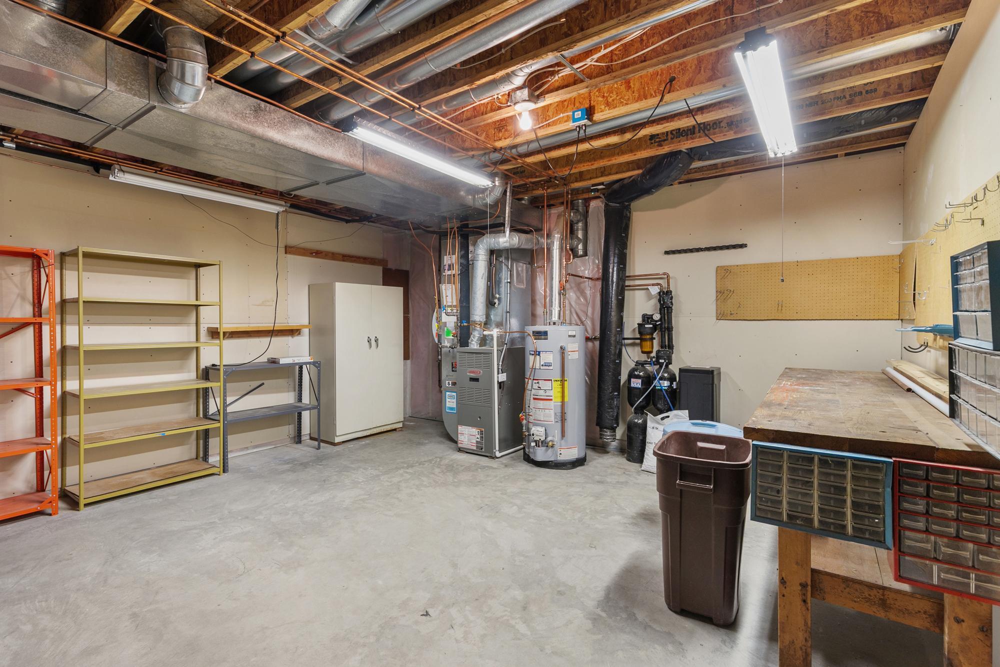 Utility / mechanical room has great storage and workshop area