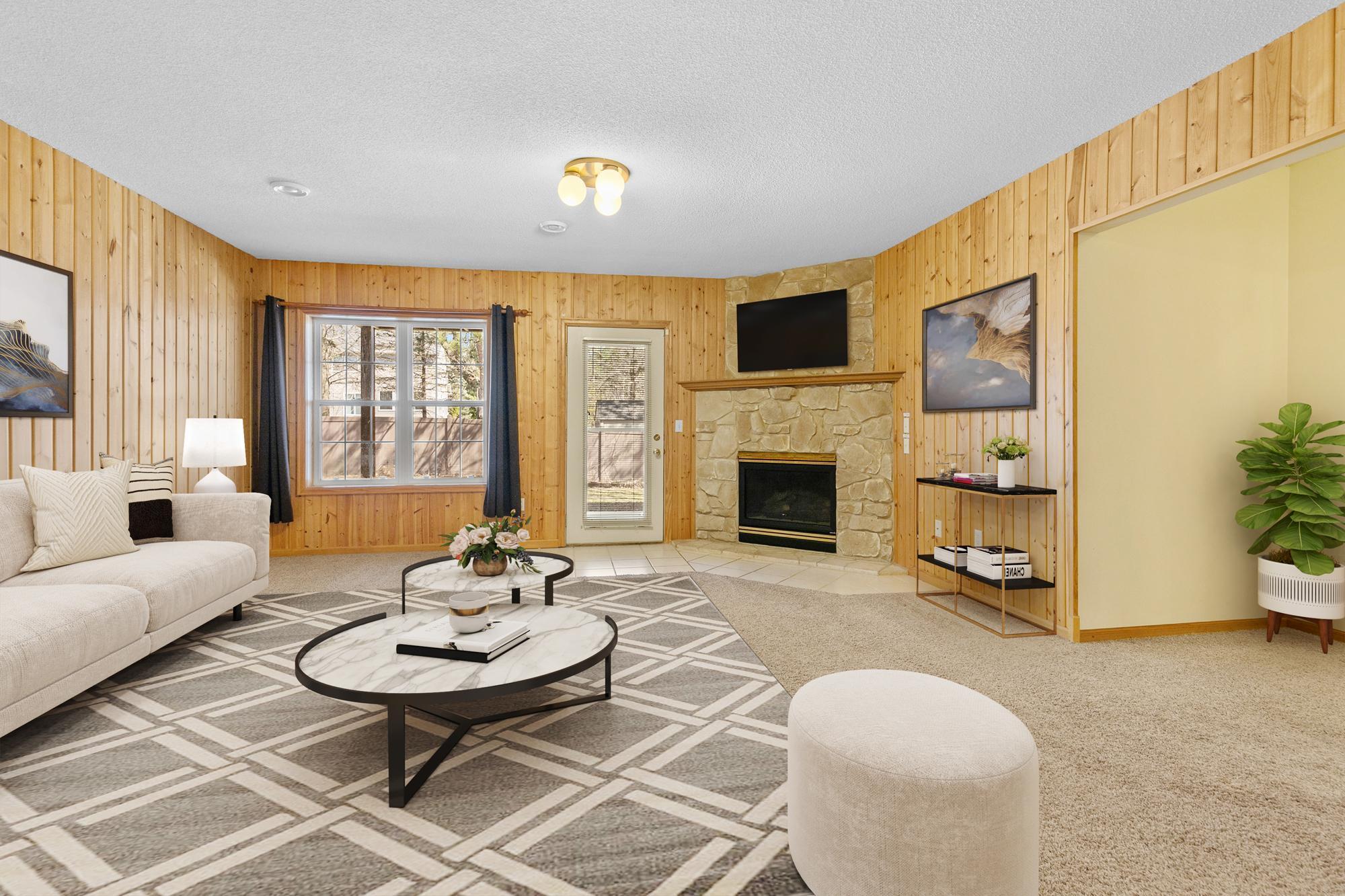 Walkout lower level family room with second fireplace virtually staged