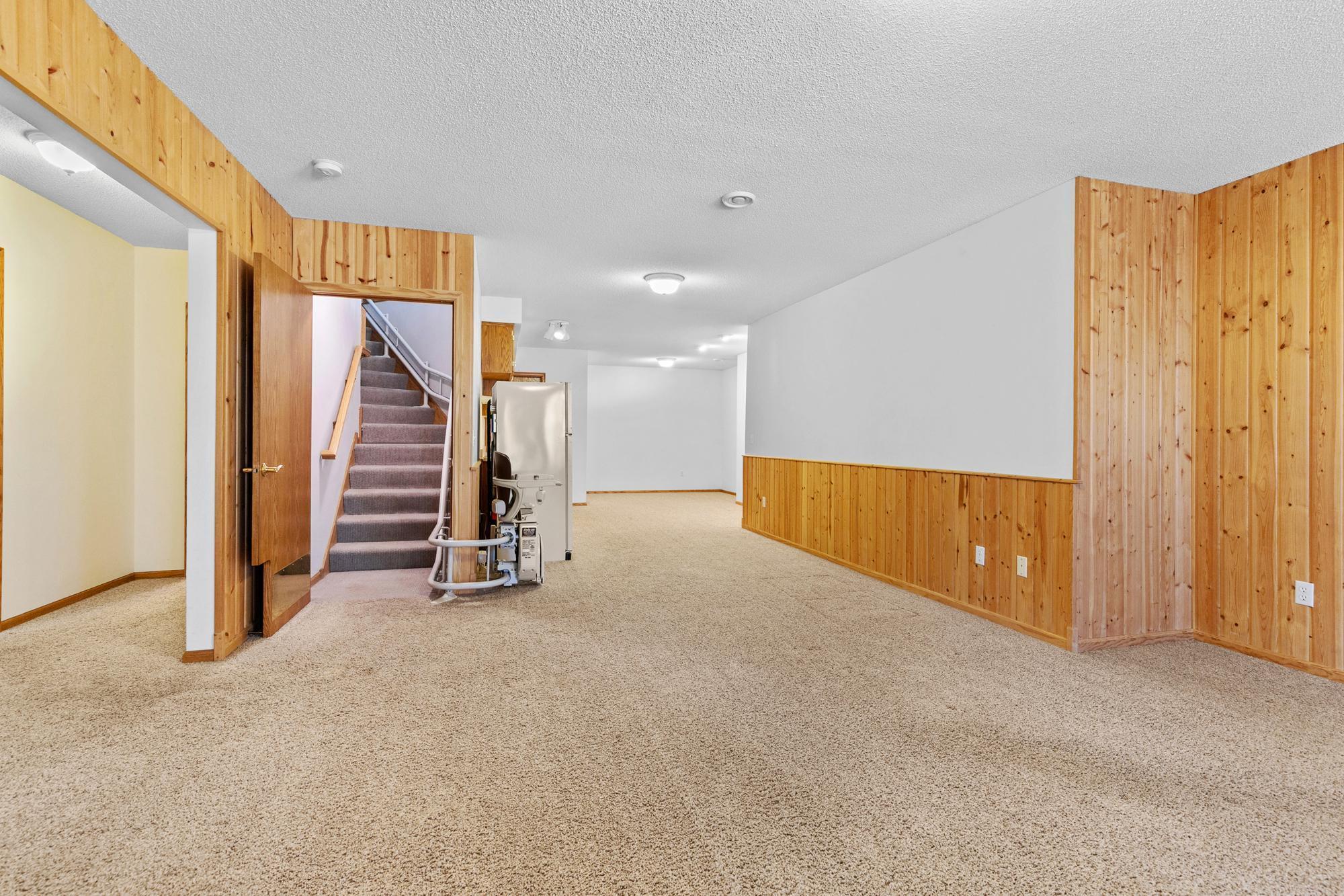 Stairs to lower level showing out of the way space for stair chair