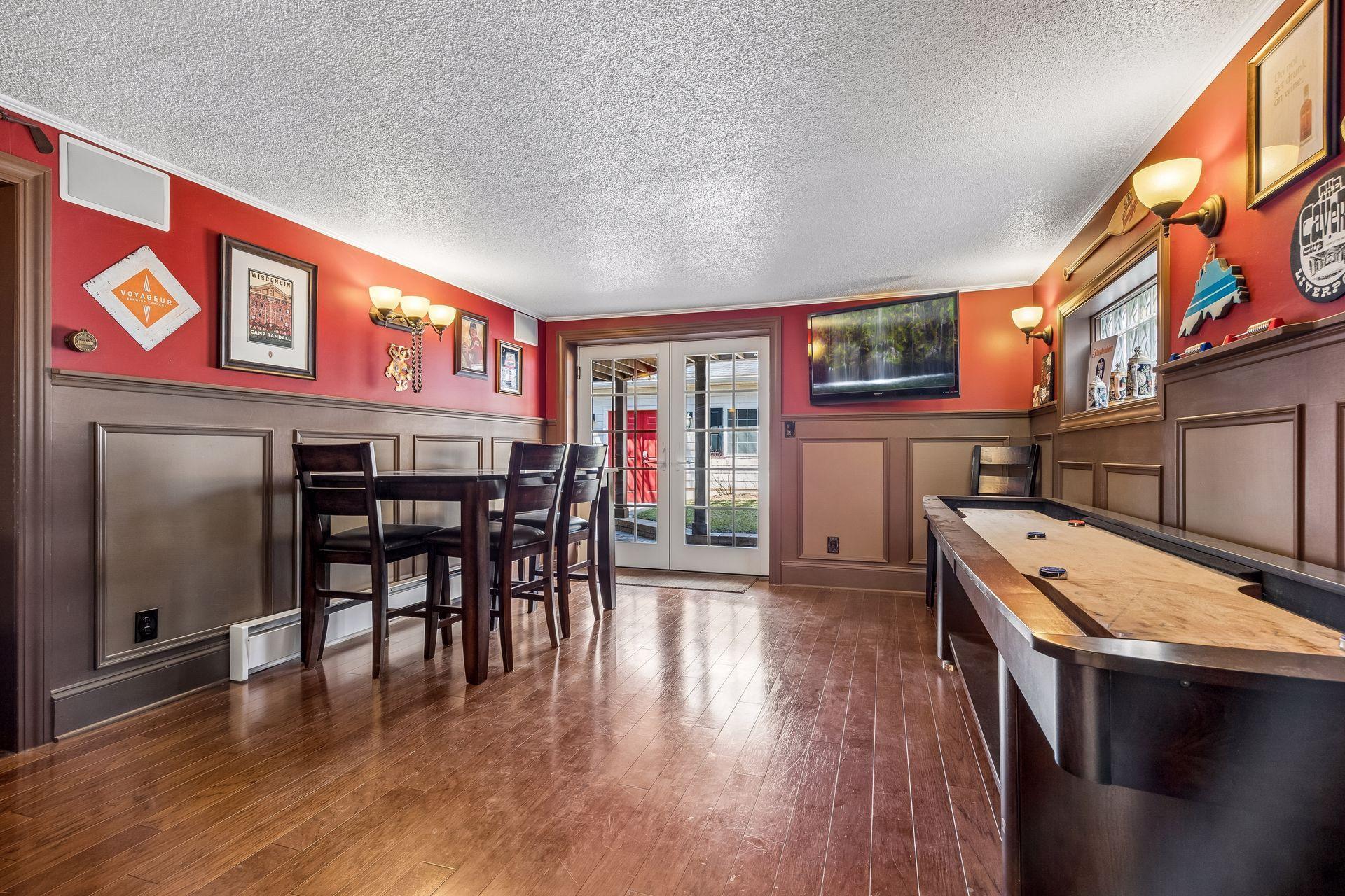 Watch the game/entertain/walks out to the backyard and patio