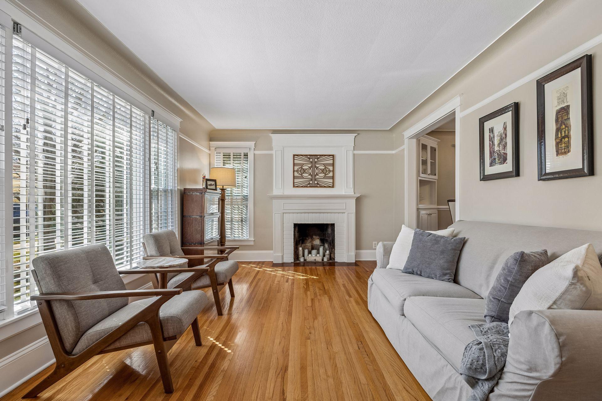 Cozy wood-burning fireplace anchors the room