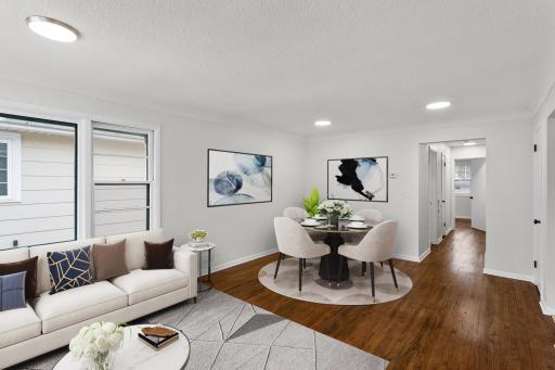 Living room and dining space- virtually staged.