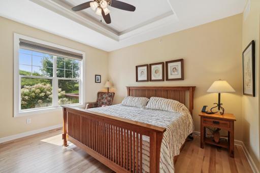 Primary bedroom suite with another tray ceiling and maple floors!