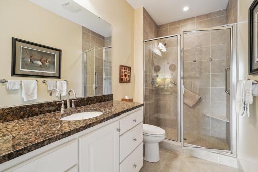 3/4 primary bath with a walk in shower