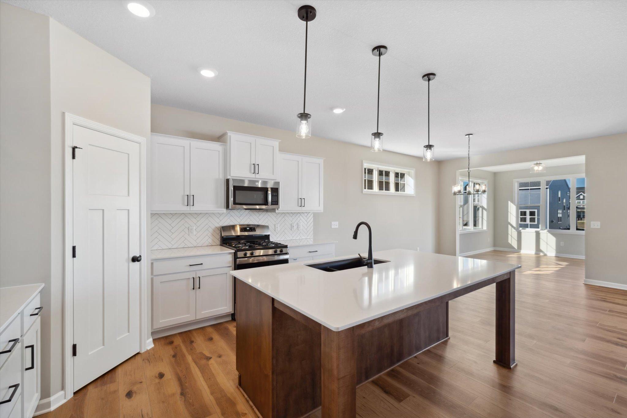Kitchen *Photo of a previously built home of the same floor plan. Finishes/options may vary.