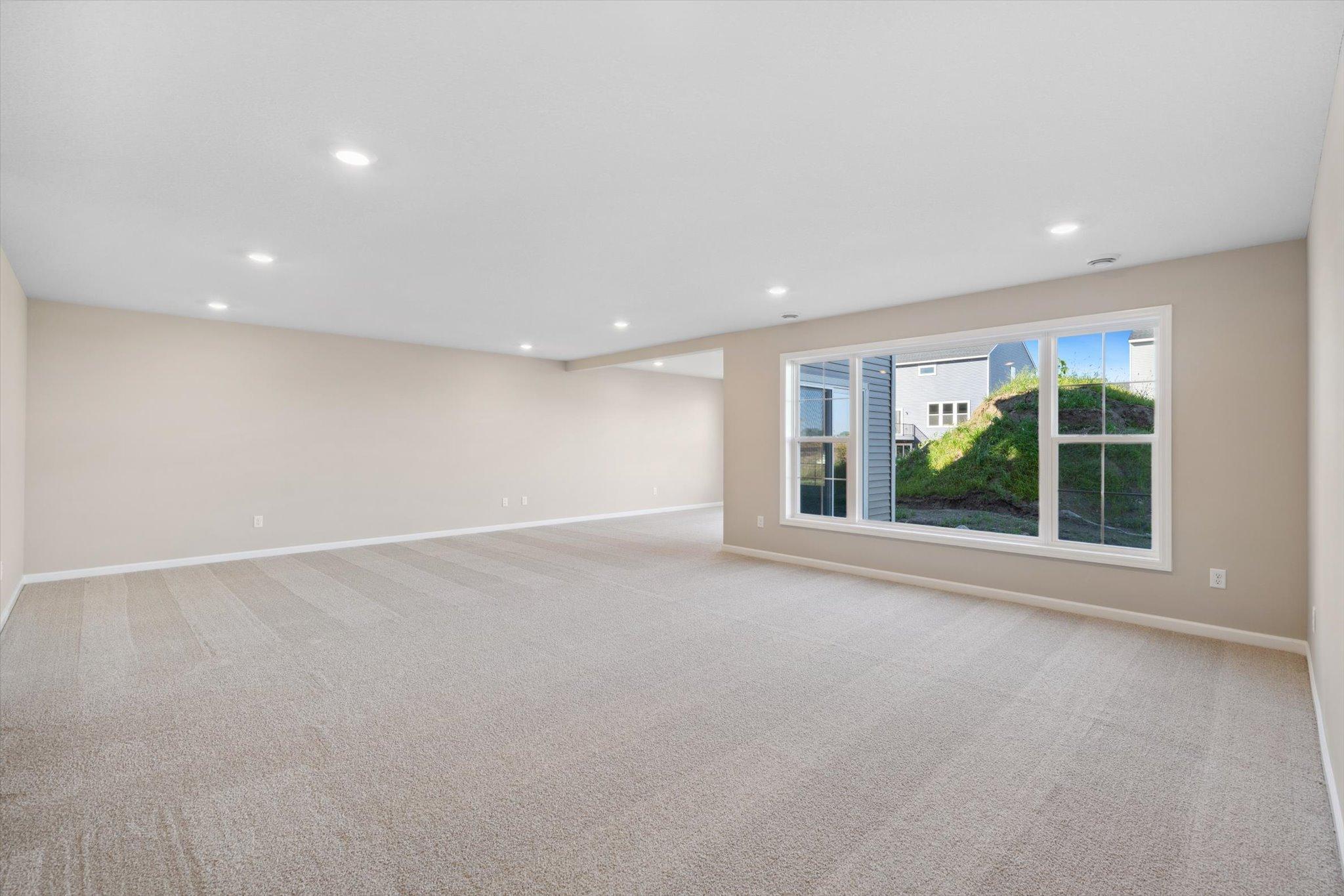 Lower Level Rec Room *Photo of a previously built home of the same floor plan. Finishes/options may vary.