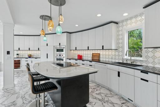 Island has a heated countertop and toe-kick lighting
