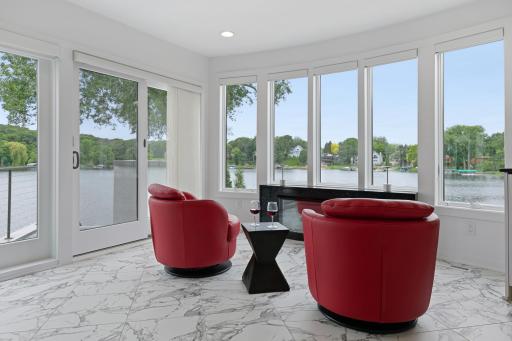 Kitchen has spacious sitting area with private deck and expansive views of Lake Riley