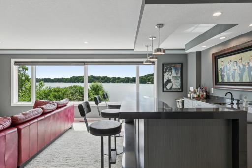 Main floor Bar and entertaining space with breath-taking views of Lake Riley