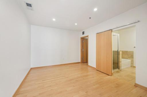 Primary bedroom w/ full bath