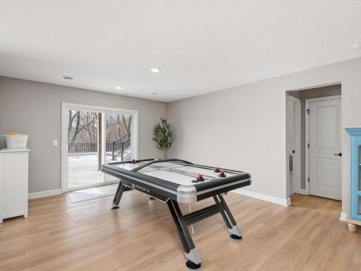 Sophisticated lower level rec room with plentiful space for billiards or game tables & beautiful views of amazing outdoor entertainment areas.