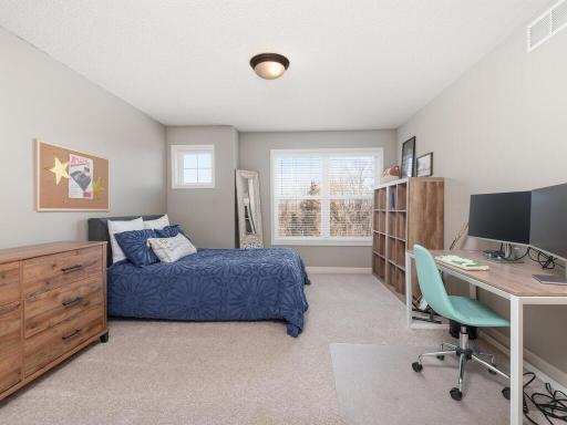 Spacious second junior bedroom on upper level with room for a variety of furniture options & direct access to a full adjoining bathroom.