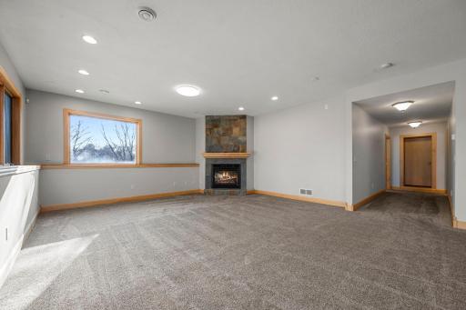 Family Room - Lower Level (flame in fireplace is digitally enhanced)