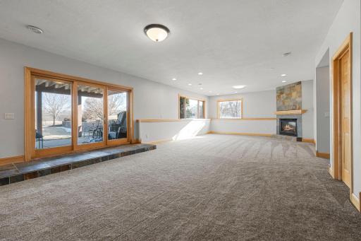 Family Room - Lower Level (flame in fireplace is digitally enhanced)