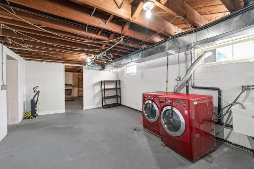 Lower level laundry room + storage space