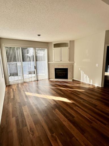 Family room view looking toward fireplace and patio doors