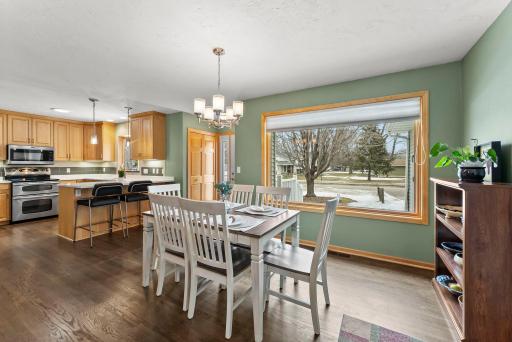 The dining area features statement lighting and connects seamlessly to the main living spaces, making it ideal for daily living and entertaining.