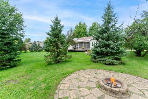 A private, built-in firepit creates an ideal setting for entertaining.