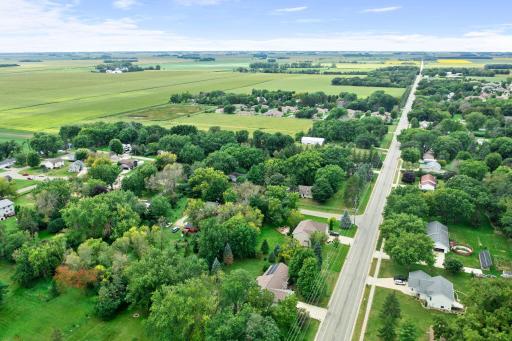 The property also offers a backyard storage shed and an added parking pad alongside the garage for extra convenience.