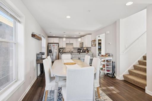 Large open concept dining room adjacent to kitchen.