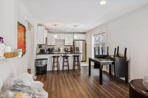 Unit 1 open concept dining and kitchen area.