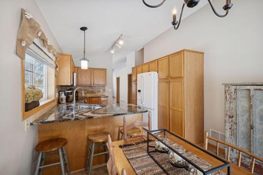 Kitchen with informal dining area and breakfast bar area