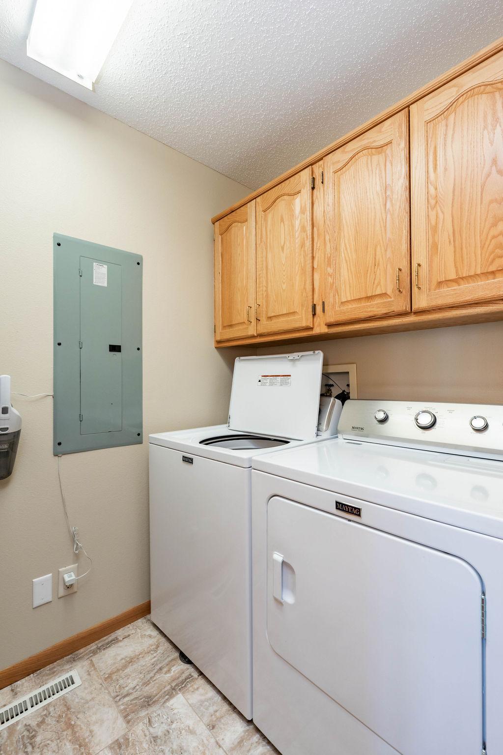 Laundry Room with storage cabinets
