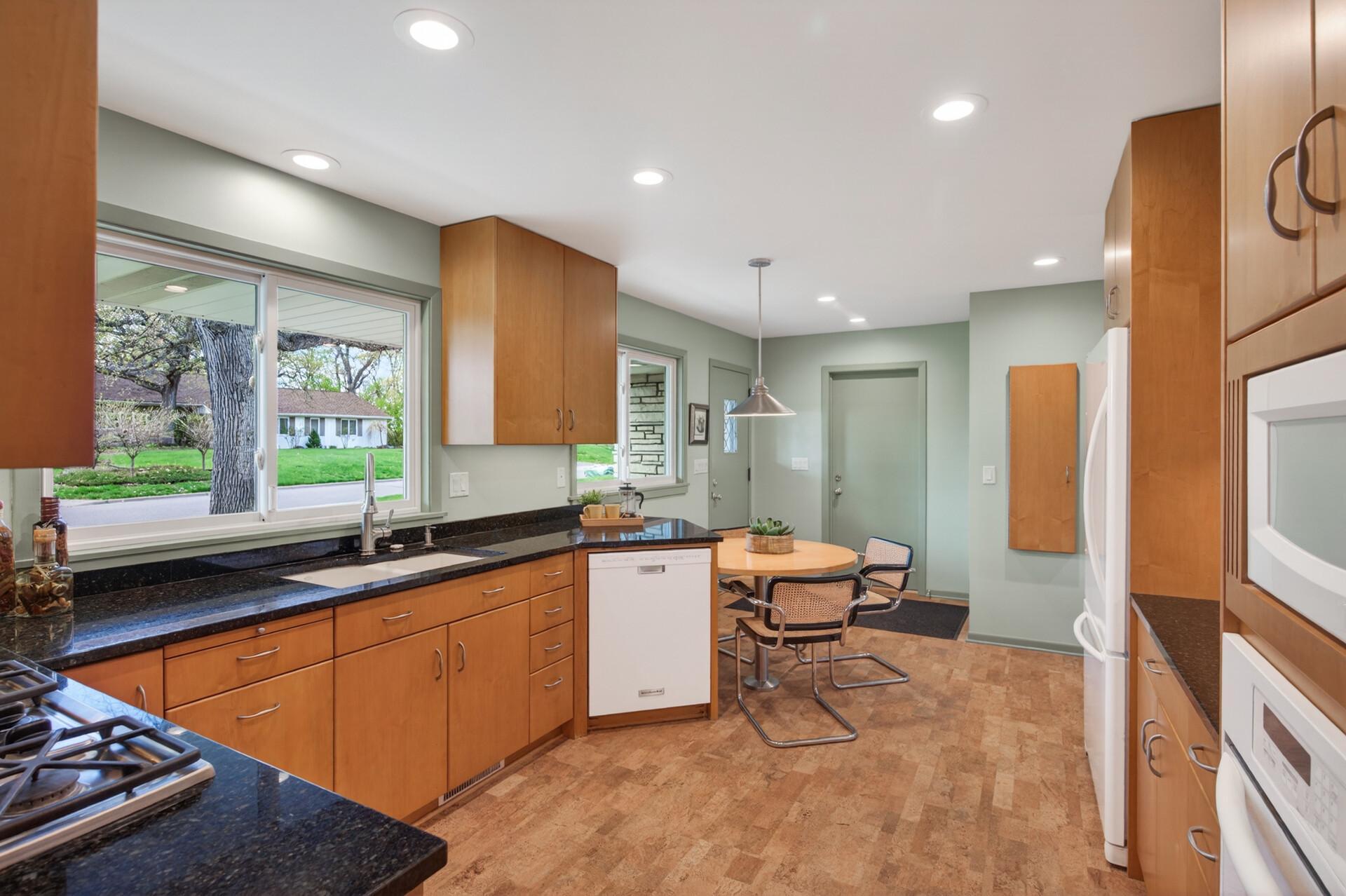 Side entrance near the garage opens into the fully remodeled kitchen