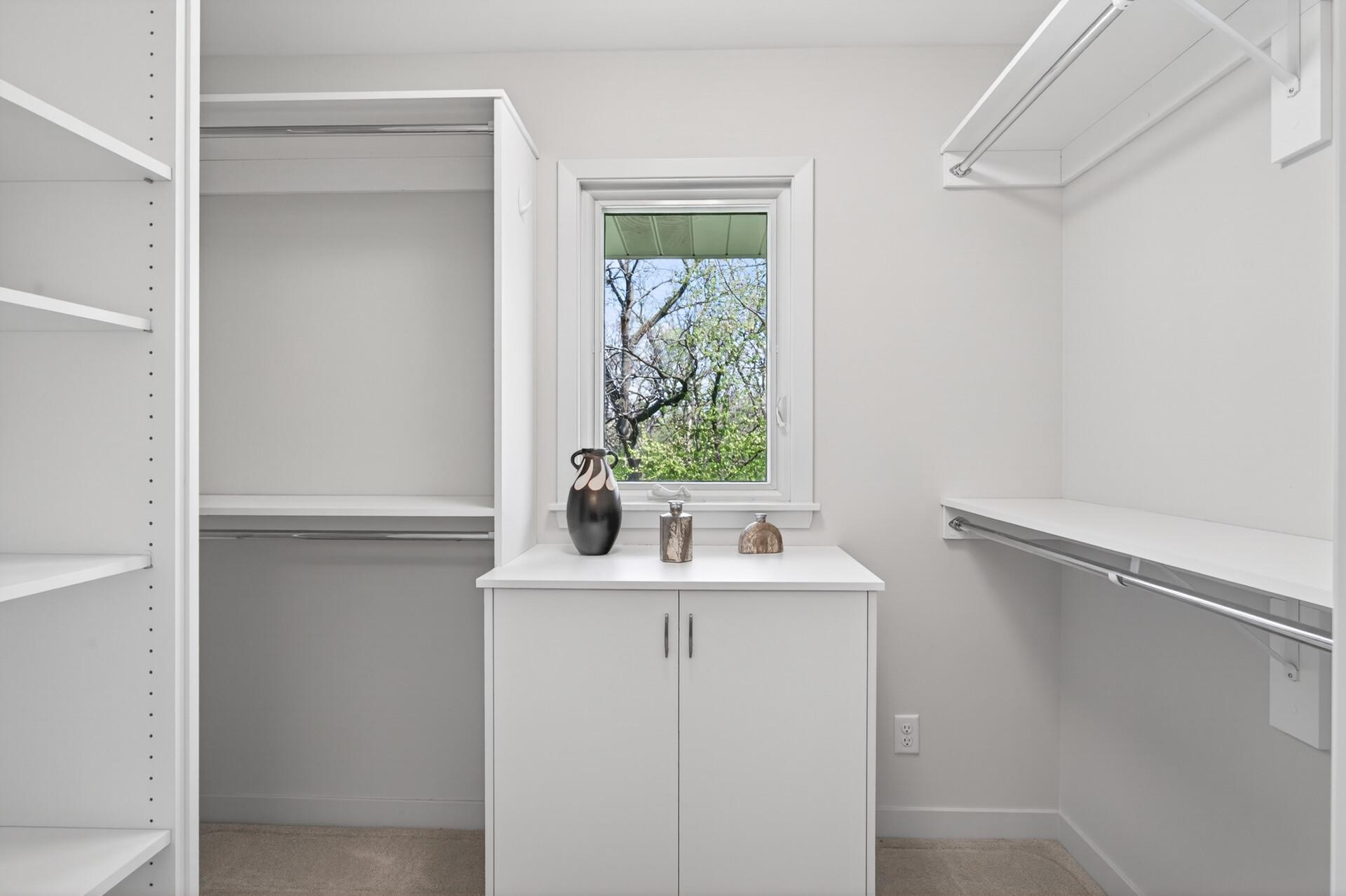 Primary walk-in closet with built-ins.