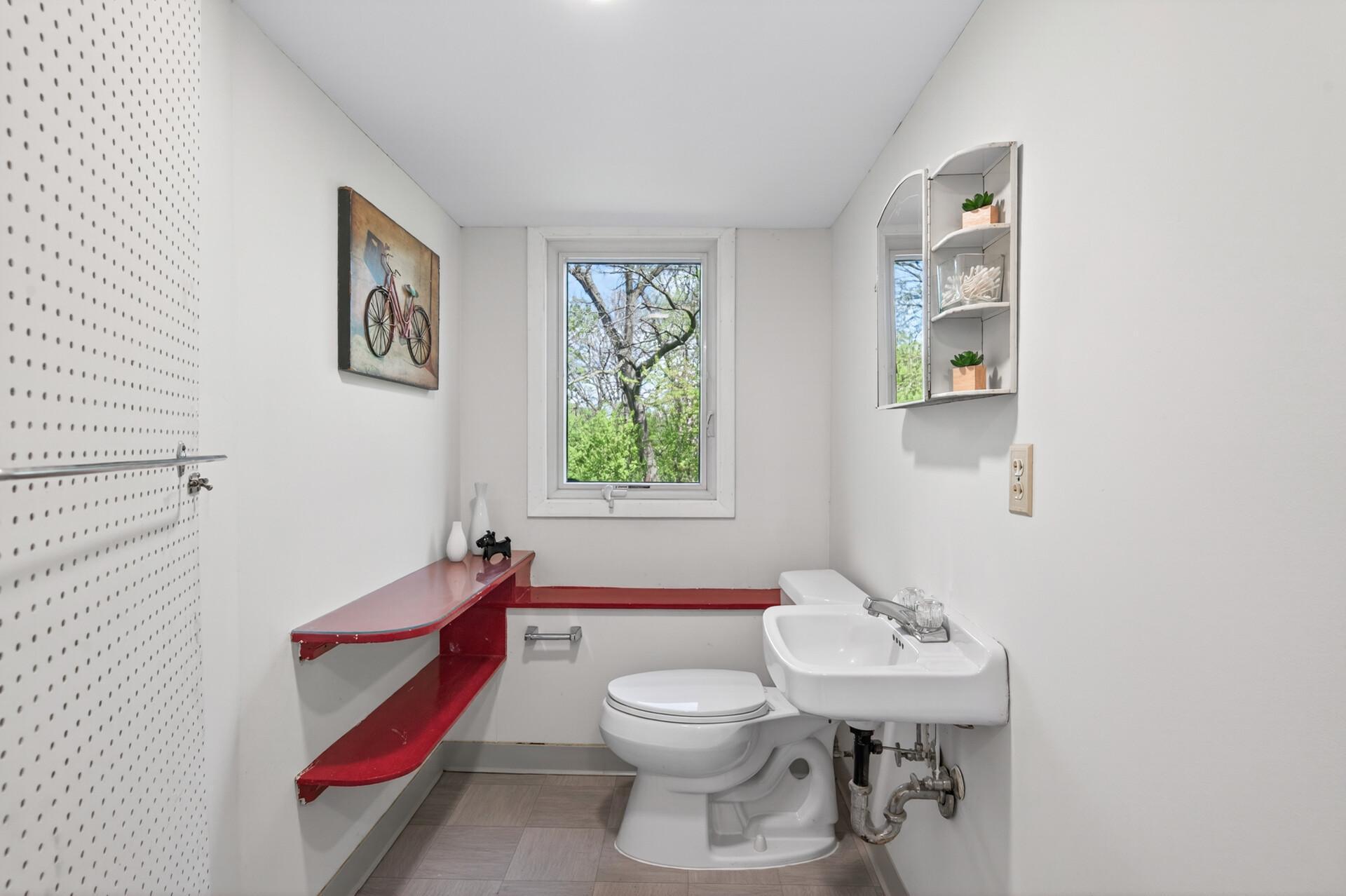 Lower level three quarter bath with new flooring & fresh paint
