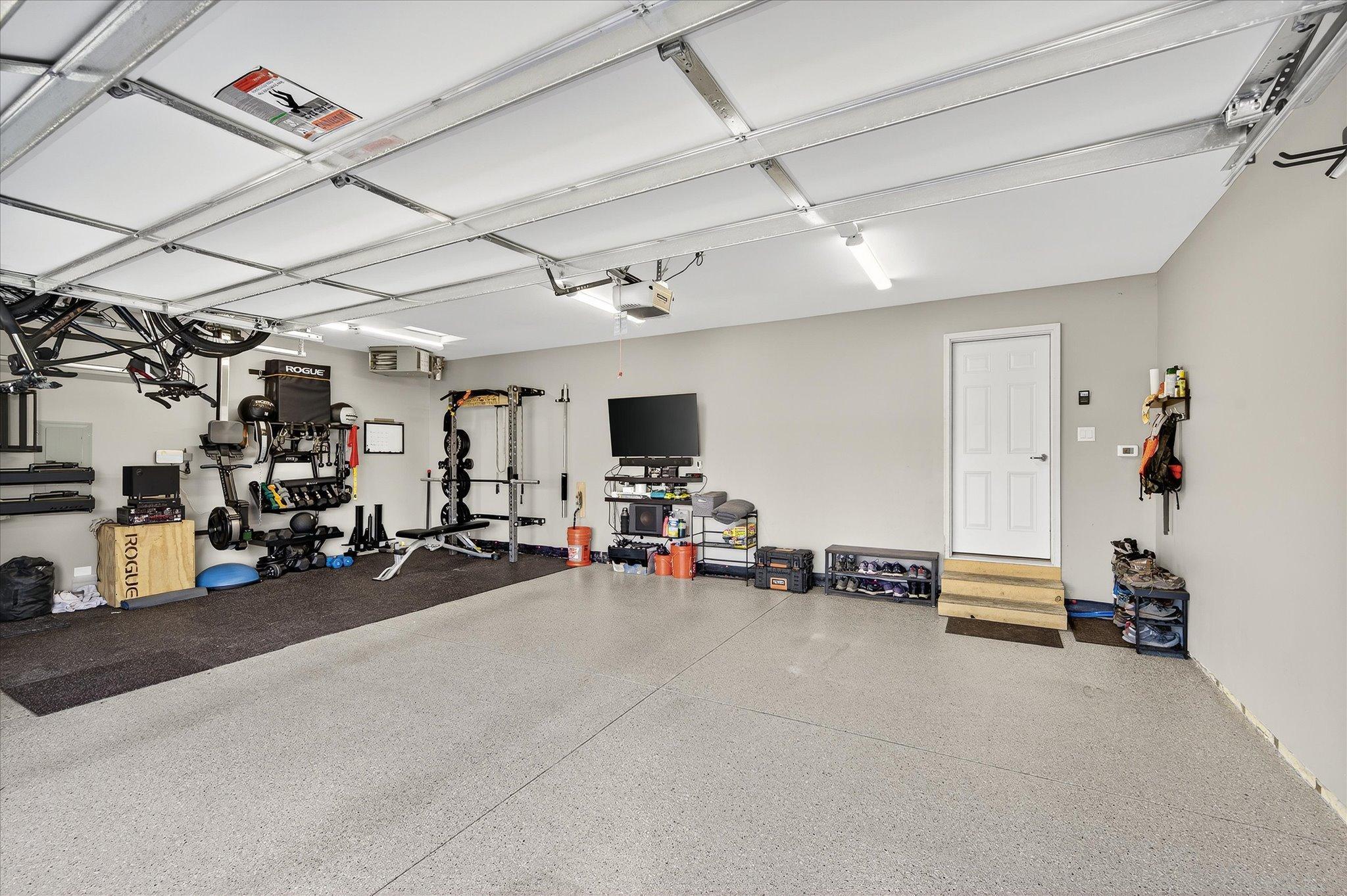 A dream garage completely finished insulated and heated with epoxy floors