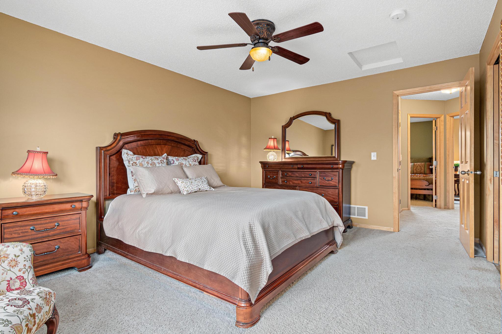 Alternate view of the bedroom showcases the spaciousness of this room and also highlights the lovely raised panel doors that are found throughout the home.