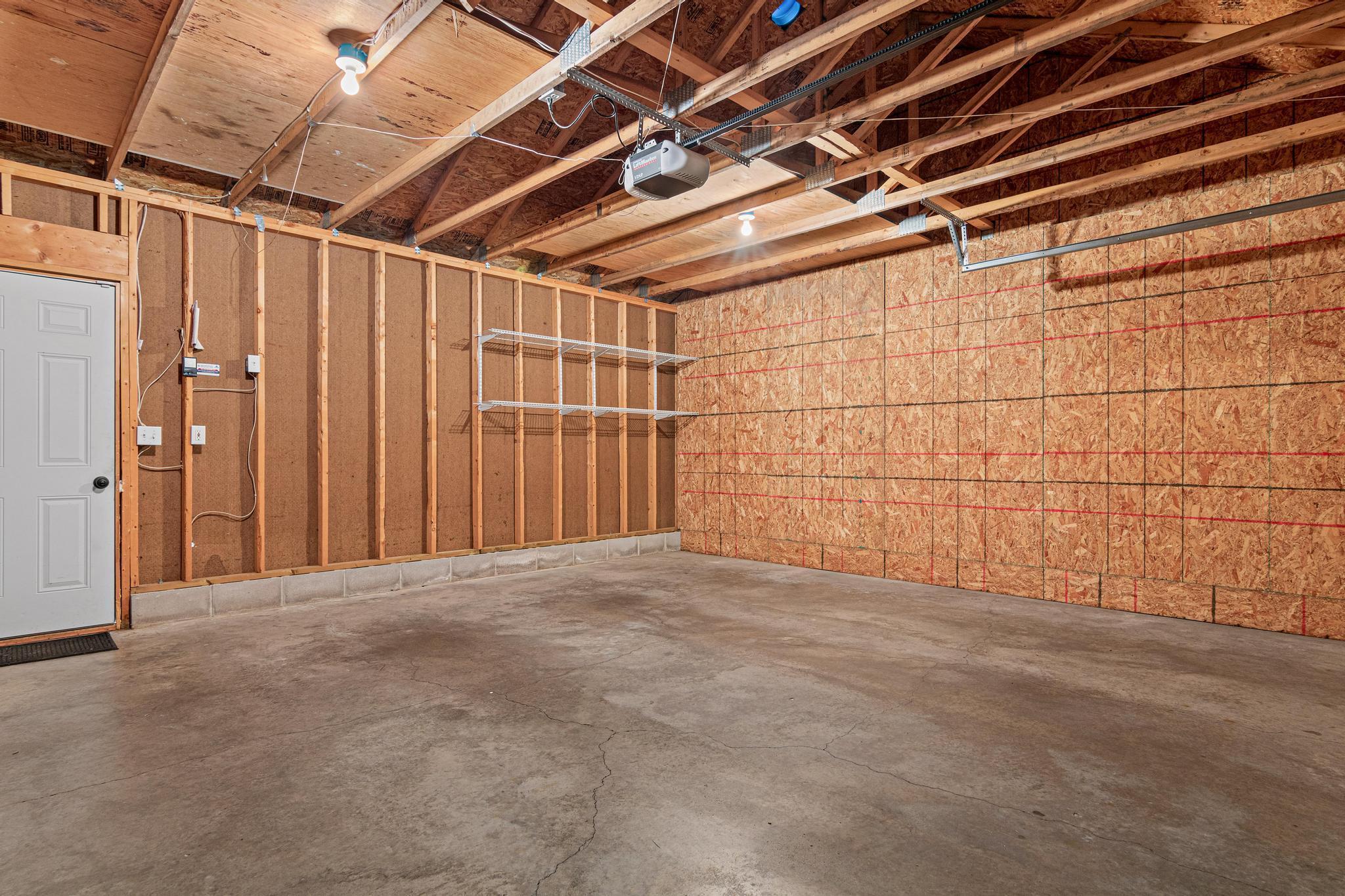The garage is very tidy and the floor is in excellent shape. Plywood has been added to the rafters for additional off season storage needs.