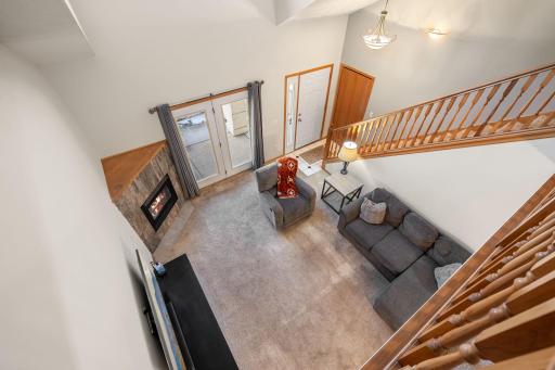 Living room view from above — overlooking the open, airy loft area.