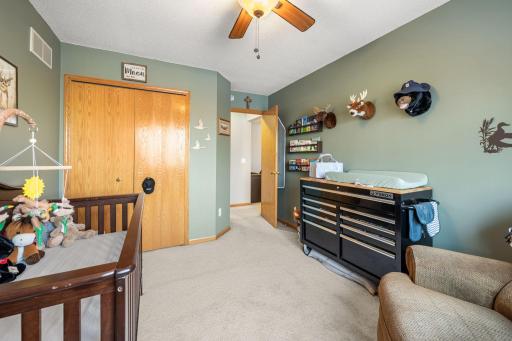 Second bedroom with a sliding closet — simple, functional.