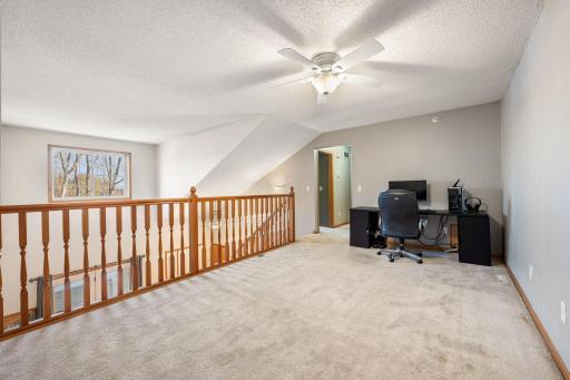 Spacious loft area — versatile space for work, play, or relaxation.