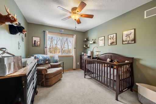 Second bedroom with a sliding closet — simple, functional.