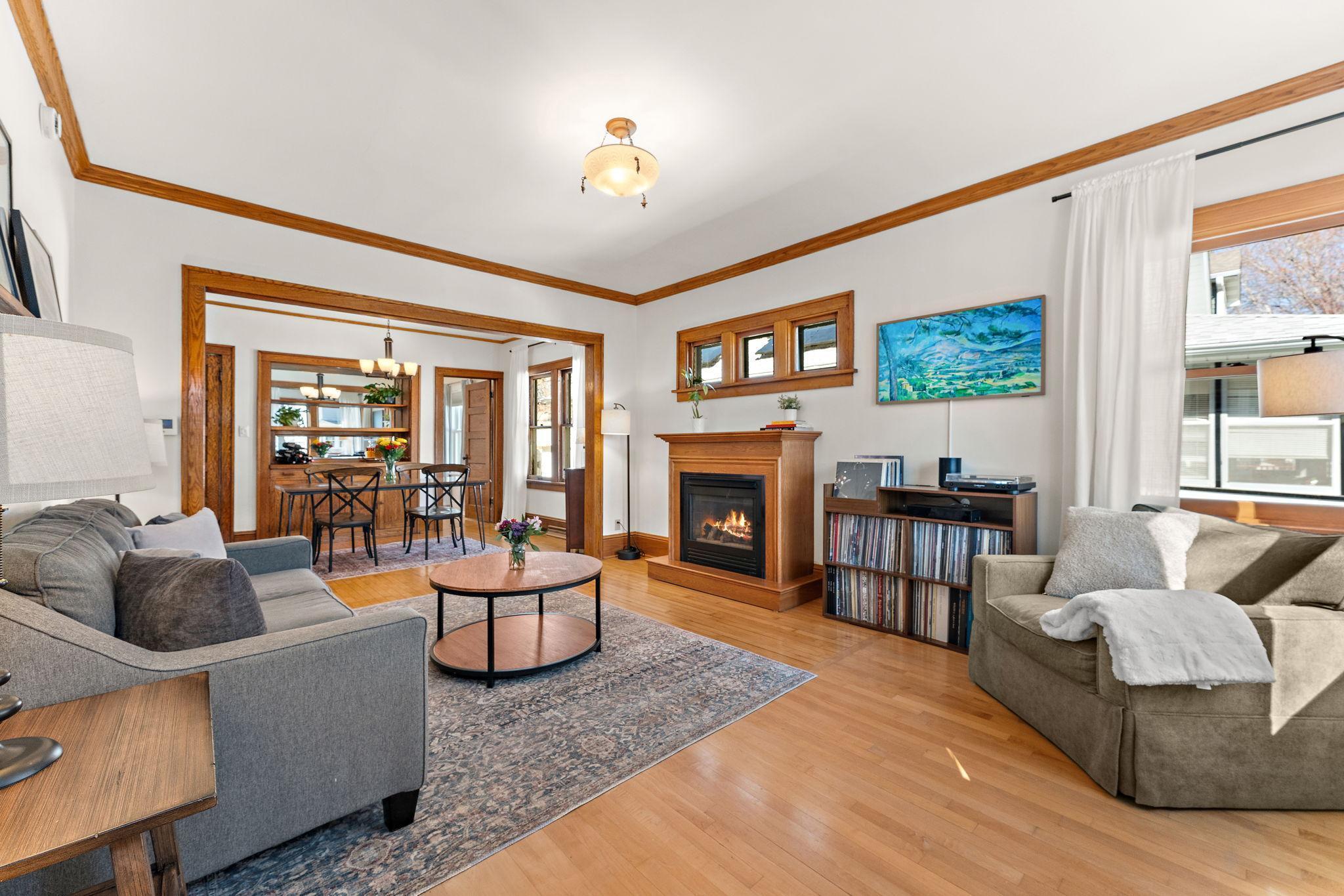 Note the gleaming hardwood floors and pristine, unpainted woodwork as you enter.